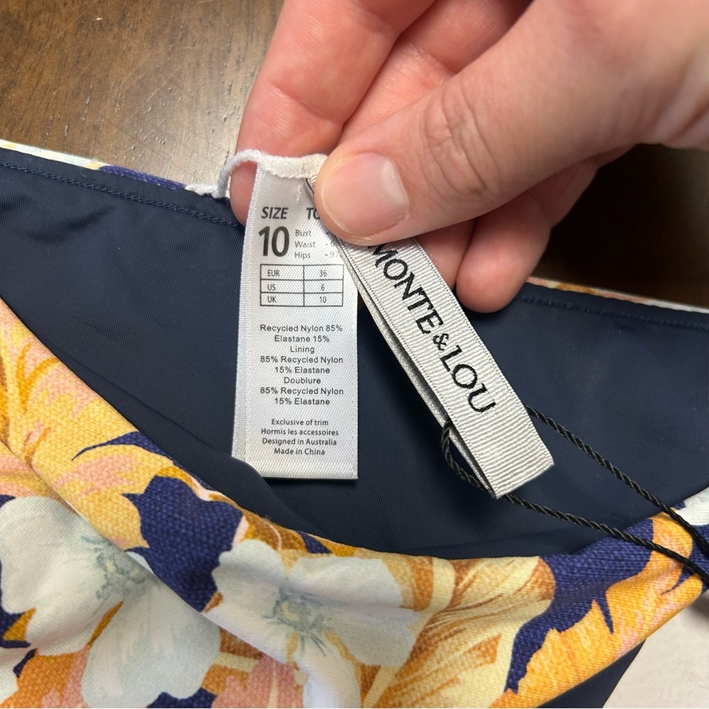 NWT Monte and Lou Paraiso Navy Blue and Orange
Floral String Bikini Set Size 6 - Picture 7 of 16
